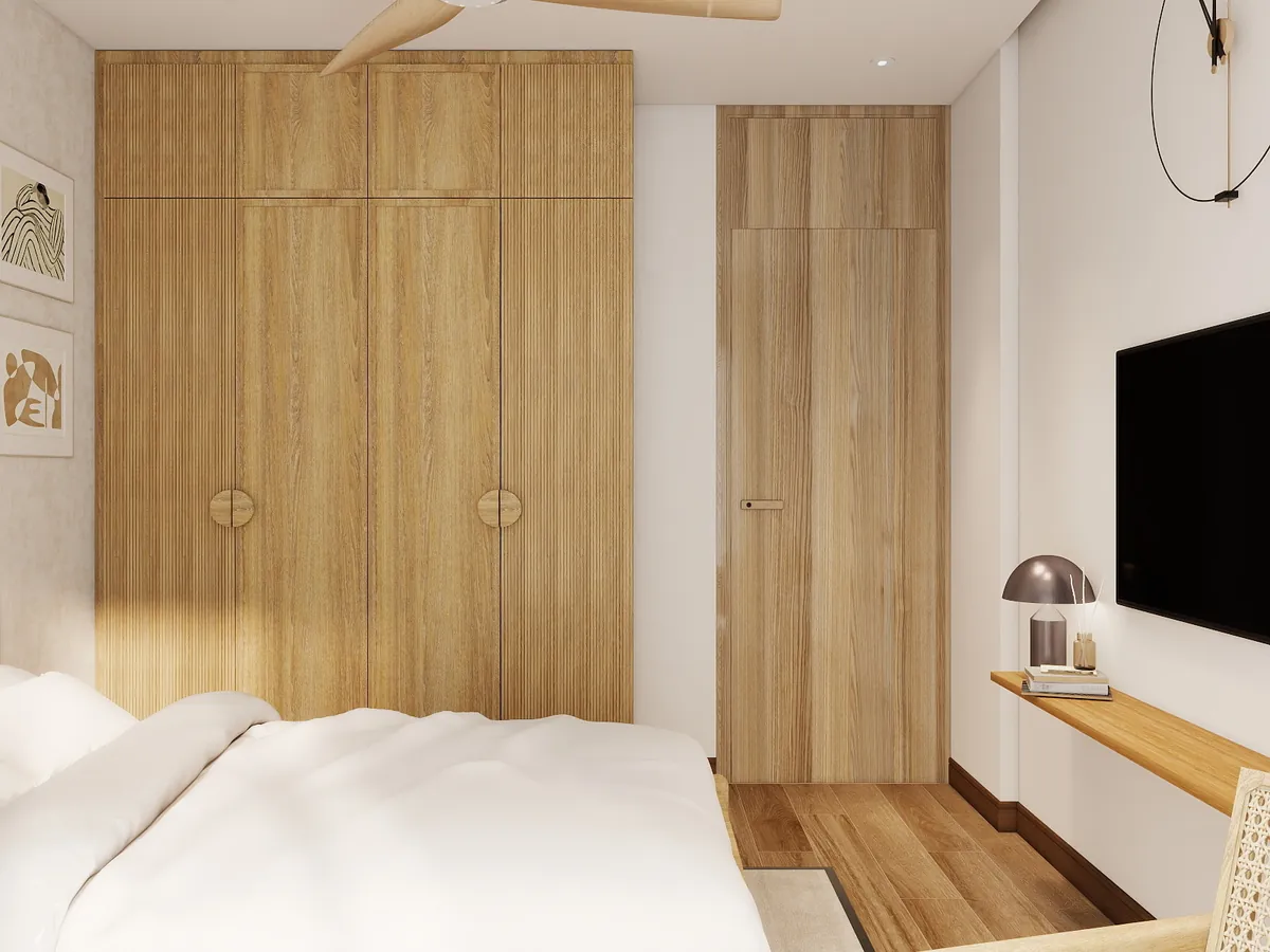 Fluted wood-finish wardrobe doors in a Gurgaon bedroom, designed by The Omega Group